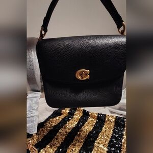 CoACH Chic Black and Gold Shoulder Bag with Textured Leather and Flap Closure